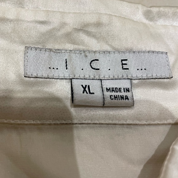 Beautiful silk blouse with black lace trim along the waist area. - Picture 8 of 10